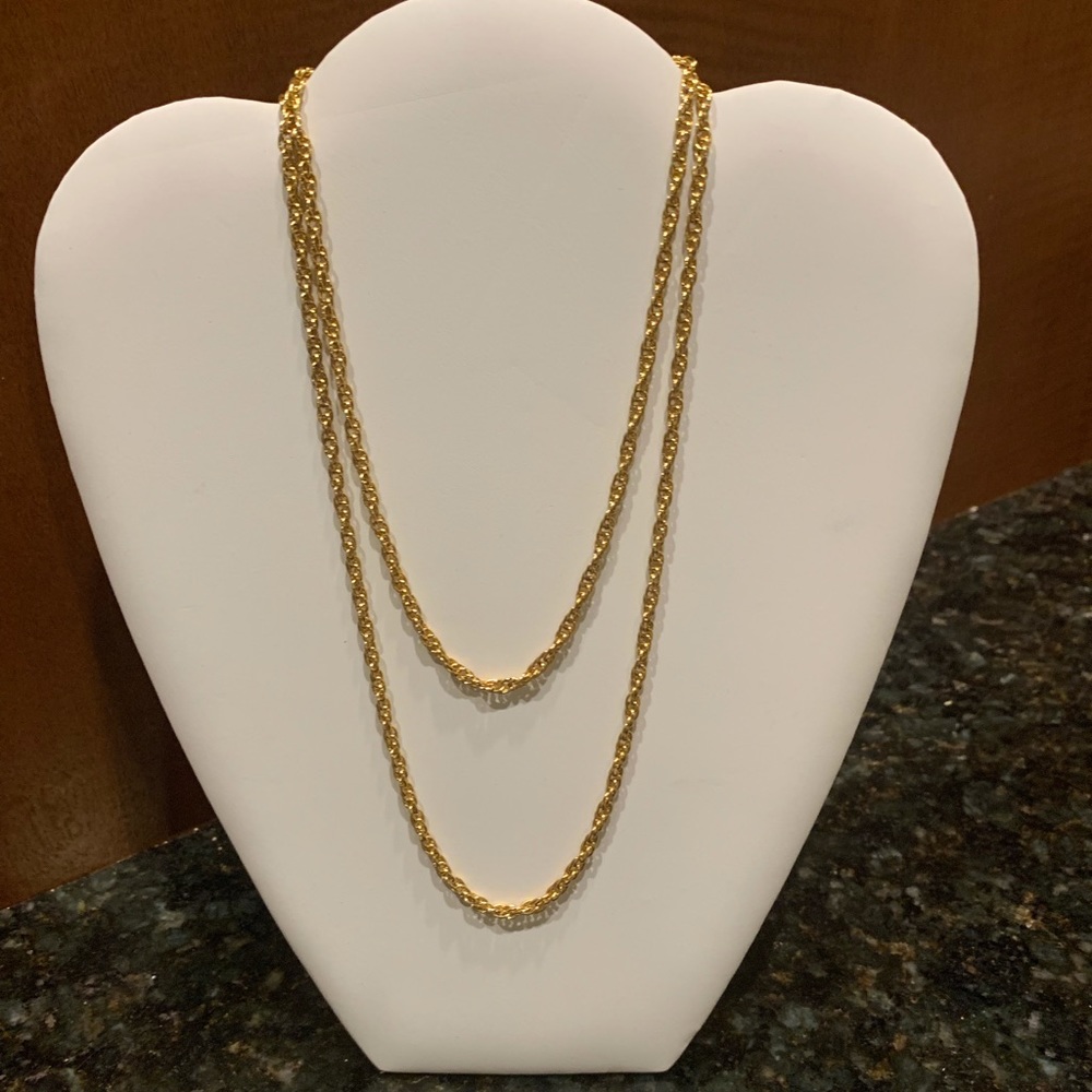 Very long gold rope chain necklace.